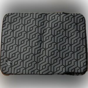 HP Reversible 14.1-inch Laptop Sleeve with a grey geometric pattern